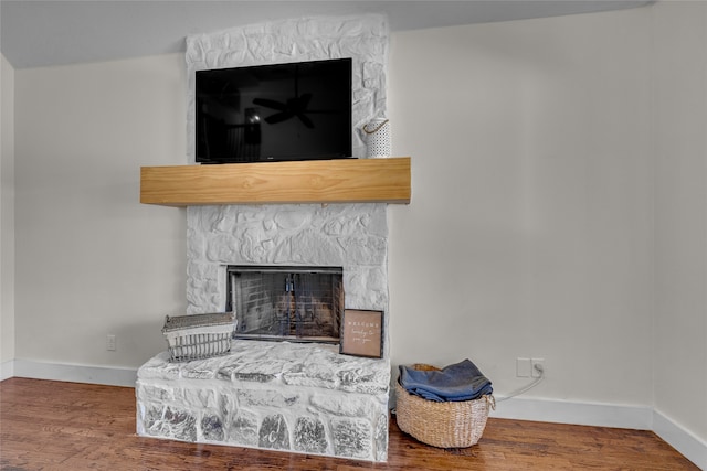 125 Wood Bend Ct, Weatherford, TX 76087 - detailed view of baseboards, wood finished floors, and a fireplace