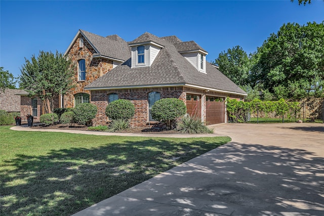 125 Wood Bend Ct, Weatherford, TX 76087 - view of front of property featuring brick siding, stone siding, a shingled roof, driveway, and a garage