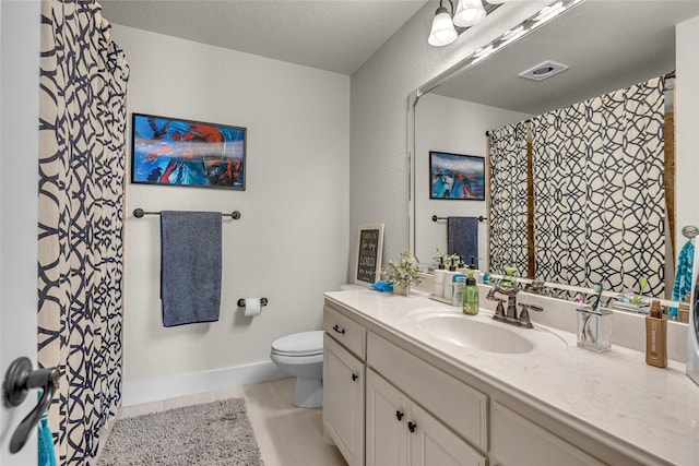 125 Wood Bend Ct, Weatherford, TX 76087 - bathroom with toilet, vanity, and tile patterned floors
