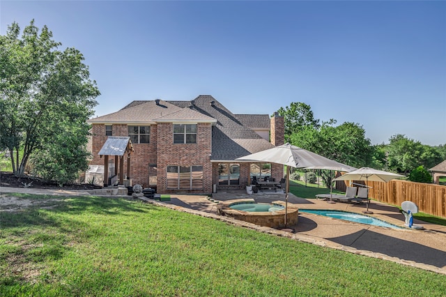 125 Wood Bend Ct, Weatherford, TX 76087 - back of property featuring an in-ground hot tub, a patio, brick siding, and roof with shingles