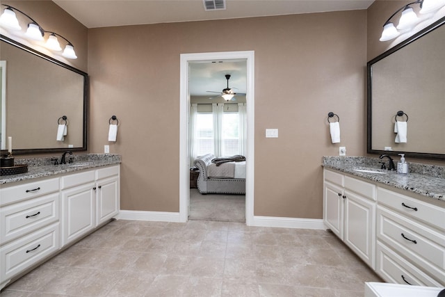 931 Champions Way, Roanoke, TX 76262 - ensuite bathroom with baseboards, two vanities, and ceiling fan