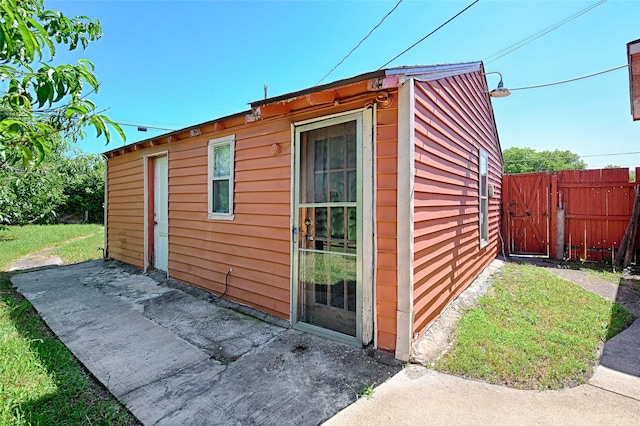 1705 Savoy St, Dallas, TX 75224 - view of outbuilding with a gate