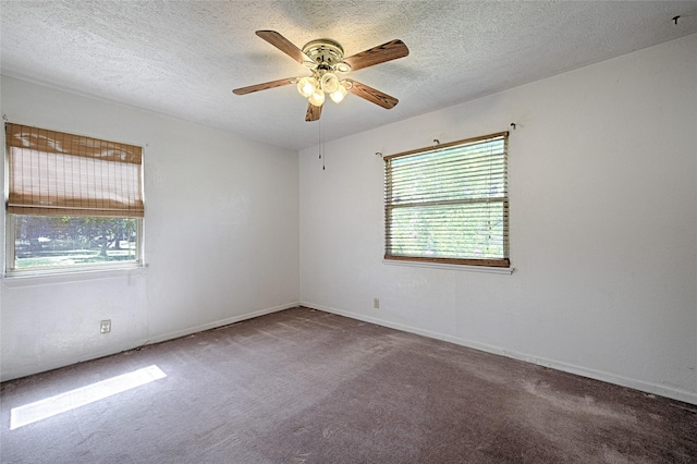 1705 Savoy St, Dallas, TX 75224 - empty room with a ceiling fan, carpet flooring, a textured ceiling, and baseboards