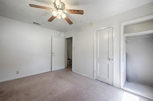 1705 Savoy St, Dallas, TX 75224 - unfurnished bedroom featuring carpet flooring, baseboards, a textured ceiling, a closet, and a ceiling fan