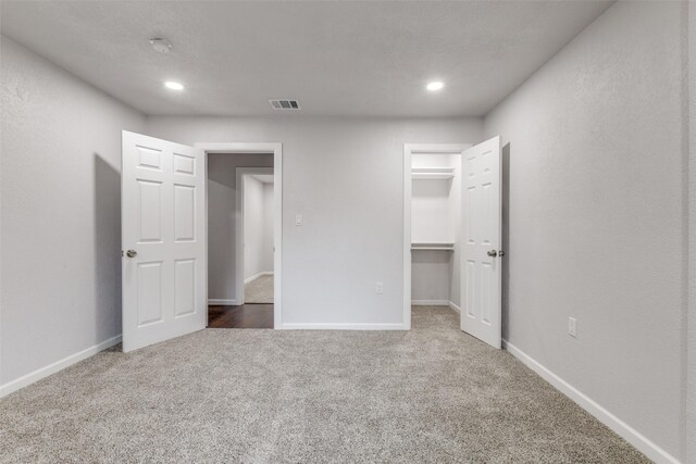 3321 NW 31st St, Fort Worth, TX 76106 - unfurnished bedroom featuring carpet floors, a walk in closet, baseboards, and recessed lighting