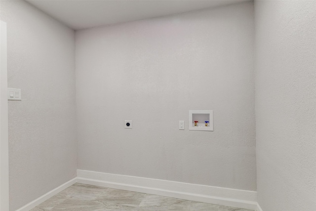 3321 NW 31st St, Fort Worth, TX 76106 - laundry area with hookup for an electric dryer, hookup for a washing machine, and baseboards