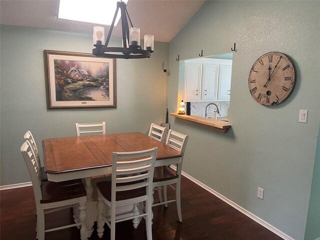 5907 Aloe Ct, Arlington, TX 76017 - dining area featuring a chandelier, dark wood-type flooring, and lofted ceiling