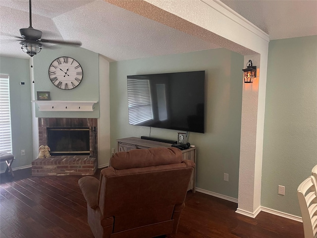 5907 Aloe Ct, Arlington, TX 76017 - living room with a brick fireplace, a ceiling fan, hardwood / wood-style flooring, and a textured ceiling