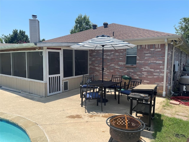 5907 Aloe Ct, Arlington, TX 76017 - rear view of property with a sunroom, a patio area, roof with shingles, and outdoor dining area