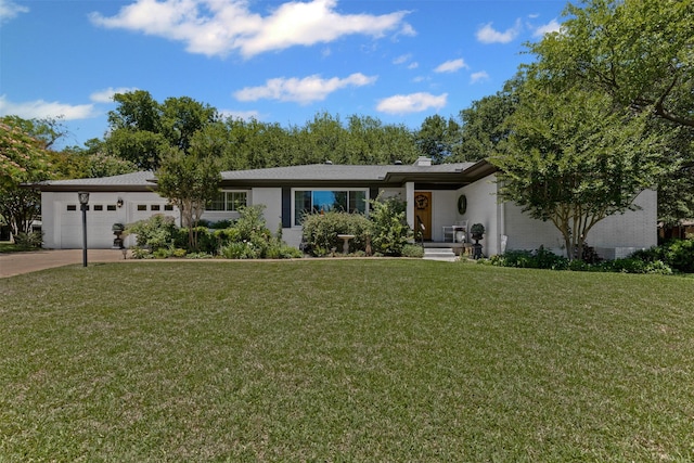 4304 Warnock Ct, Fort Worth, TX 76109 - view of front of home featuring a garage, a front lawn, concrete driveway, a chimney, and brick siding