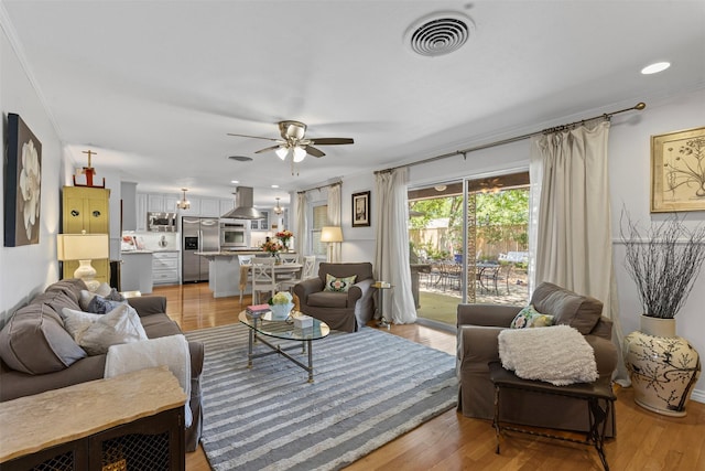 4304 Warnock Ct, Fort Worth, TX 76109 - living room with a ceiling fan, light wood-style flooring, and crown molding