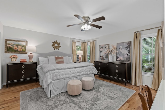 4304 Warnock Ct, Fort Worth, TX 76109 - bedroom with multiple windows, wood finished floors, and a ceiling fan