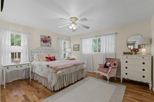 4304 Warnock Ct, Fort Worth, TX 76109 - bedroom with multiple windows, wood finished floors, and a ceiling fan