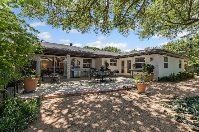 4304 Warnock Ct, Fort Worth, TX 76109 - back of property with a patio and french doors