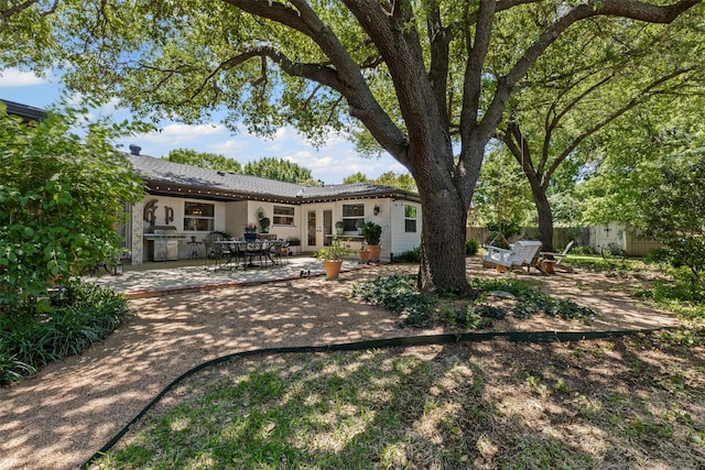 4304 Warnock Ct, Fort Worth, TX 76109 - rear view of property with french doors and a patio area