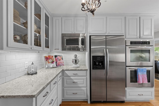 4304 Warnock Ct, Fort Worth, TX 76109 - kitchen featuring stainless steel appliances, white cabinets, and glass insert cabinets