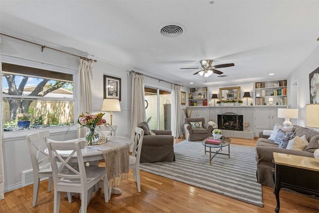 4304 Warnock Ct, Fort Worth, TX 76109 - living area featuring ceiling fan, light wood-type flooring, and a fireplace