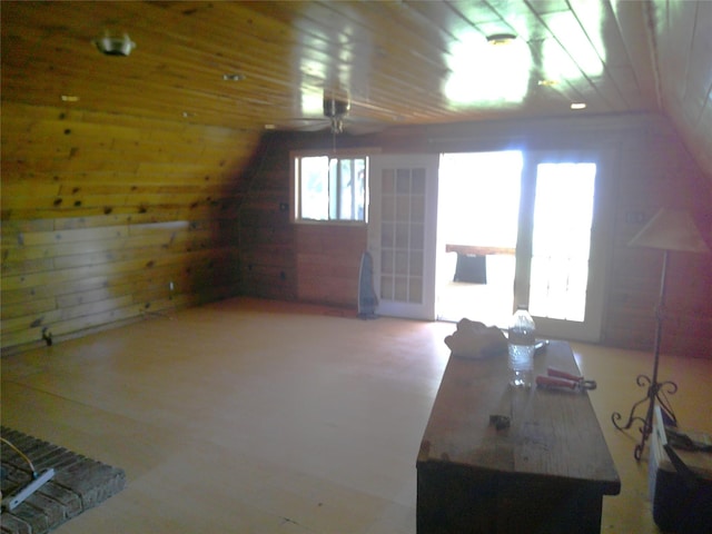 999 Roberts Cut Off Rd, Bowie, TX 76230 - additional living space with wooden walls, vaulted ceiling, and ceiling fan