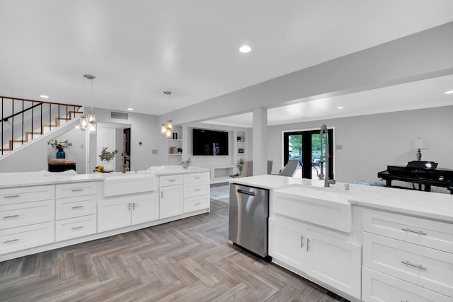1015 S Lowrance Rd, Pecan Hill, TX 75154 - kitchen with stainless steel dishwasher, open floor plan, recessed lighting, white cabinets, and light stone counters
