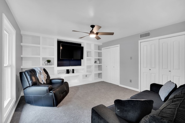 1015 S Lowrance Rd, Pecan Hill, TX 75154 - living room with carpet, a ceiling fan, baseboards, and built in features