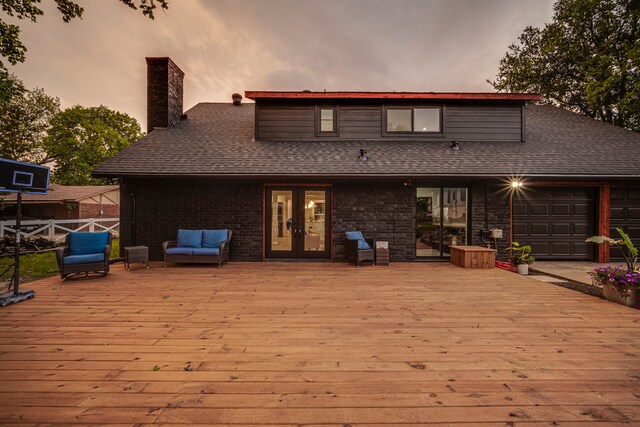 1015 S Lowrance Rd, Pecan Hill, TX 75154 - back of property featuring french doors, a wooden deck, a chimney, and a shingled roof