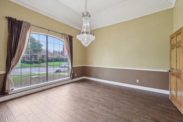 906 Greenbriar Ln, Duncanville, TX 75137 - spare room with a chandelier, dark wood-style floors, and baseboards