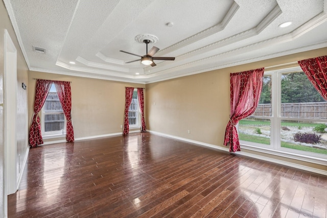 906 Greenbriar Ln, Duncanville, TX 75137 - empty room with a tray ceiling, crown molding, a textured ceiling, a ceiling fan, and baseboards