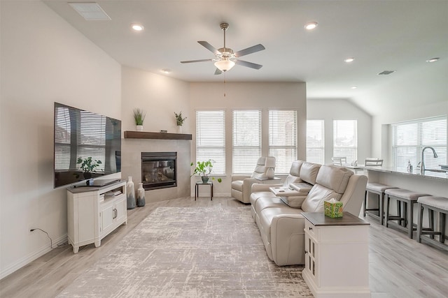 7200 Paso Verde Dr, Fort Worth, TX 76131 - living room featuring a ceiling fan, light wood finished floors, recessed lighting, baseboards, and a tile fireplace