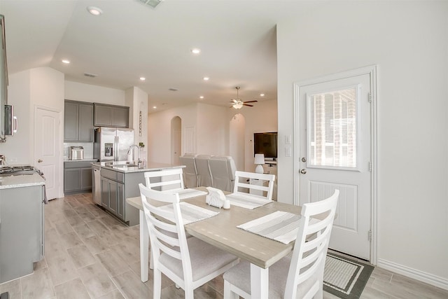 7200 Paso Verde Dr, Fort Worth, TX 76131 - dining room featuring arched walkways, ceiling fan, recessed lighting, light wood-style flooring, and lofted ceiling