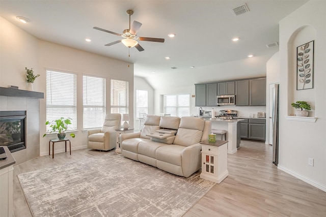 7200 Paso Verde Dr, Fort Worth, TX 76131 - living area featuring a ceiling fan, light wood-style floors, baseboards, a tile fireplace, and recessed lighting