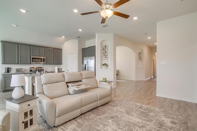 7200 Paso Verde Dr, Fort Worth, TX 76131 - living room featuring arched walkways, ceiling fan, light wood-style floors, recessed lighting, and baseboards