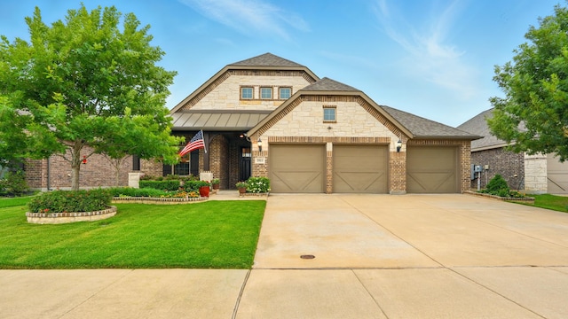 2813 Chestnut Ln, Melissa, TX 75454 - view of front facade featuring a front lawn, a garage, concrete driveway, brick siding, and a standing seam roof