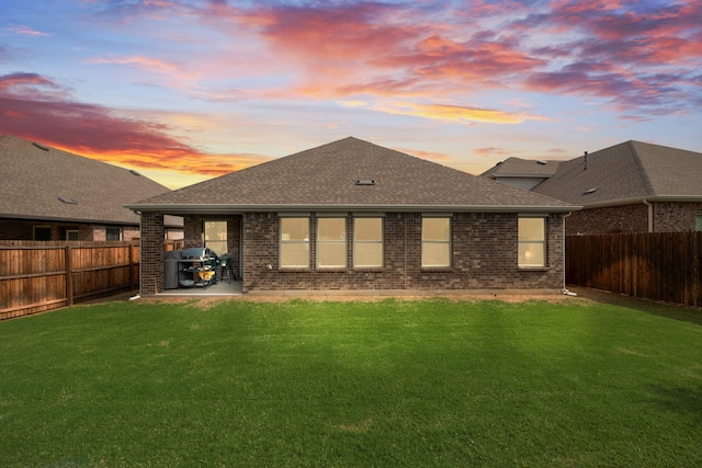 10213 Plumlee Ln, Aubrey, TX 76227 - back of house featuring roof with shingles, brick siding, and a patio