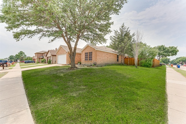 1900 Clear Creek Dr, Little Elm, TX 75068 - view of front of property with concrete driveway, brick siding, and an attached garage