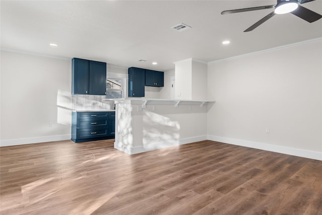 3408 Medallion Cir, Waco, TX 76706 - unfurnished living room with ornamental molding, baseboards, ceiling fan, recessed lighting, and wood finished floors