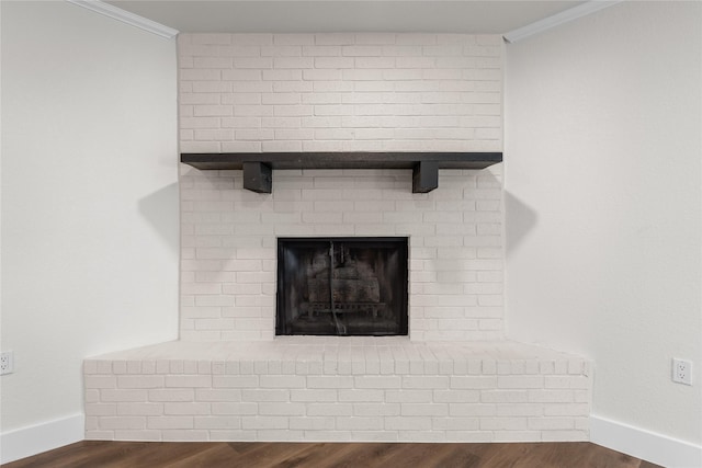 3408 Medallion Cir, Waco, TX 76706 - detailed view of ornamental molding, wood finished floors, baseboards, and a brick fireplace