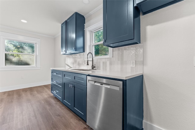3408 Medallion Cir, Waco, TX 76706 - kitchen featuring stainless steel dishwasher, ornamental molding, a sink, light countertops, and dark wood-style floors