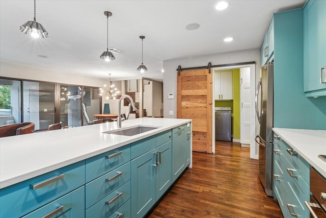 133 Lakeridge Dr, Dallas, TX 75218 - kitchen with washer / clothes dryer, a barn door, recessed lighting, light countertops, and freestanding refrigerator