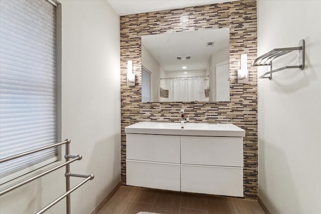 133 Lakeridge Dr, Dallas, TX 75218 - full bathroom with vanity, tile walls, and a shower with shower curtain