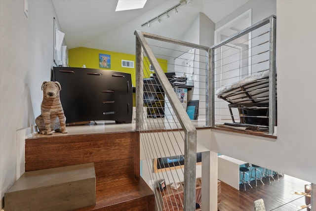 133 Lakeridge Dr, Dallas, TX 75218 - stairs featuring lofted ceiling and a skylight