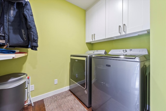 133 Lakeridge Dr, Dallas, TX 75218 - laundry area with cabinet space, washing machine and clothes dryer, and wood finished floors