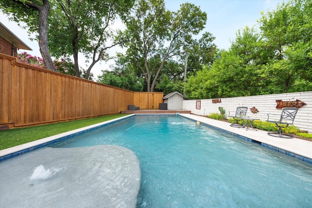 133 Lakeridge Dr, Dallas, TX 75218 - view of swimming pool with a fenced backyard and a storage unit
