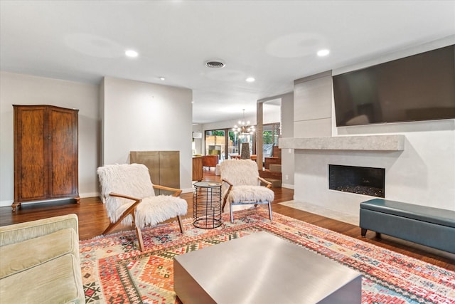 133 Lakeridge Dr, Dallas, TX 75218 - living room featuring wood finished floors, recessed lighting, a chandelier, and a fireplace with flush hearth