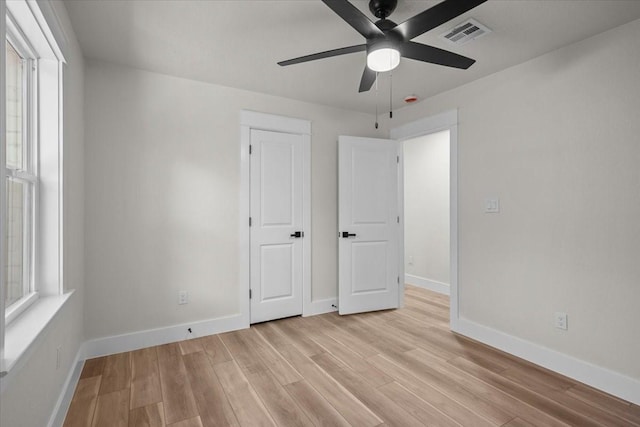 607 Audrey Ave, Waco, TX 76705 - unfurnished bedroom with light wood-style floors, baseboards, and a ceiling fan