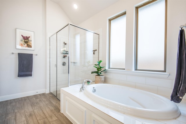 3717 Silver Birch Dr, Mckinney, TX 75071 - full bath featuring a garden tub, a shower stall, wood finished floors, baseboards, and vaulted ceiling