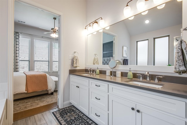 3717 Silver Birch Dr, Mckinney, TX 75071 - bathroom featuring double vanity, ceiling fan, ensuite bathroom, lofted ceiling, and wood finished floors