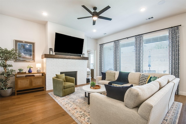 3717 Silver Birch Dr, Mckinney, TX 75071 - living room with wood finished floors, ceiling fan, healthy amount of natural light, a fireplace, and recessed lighting