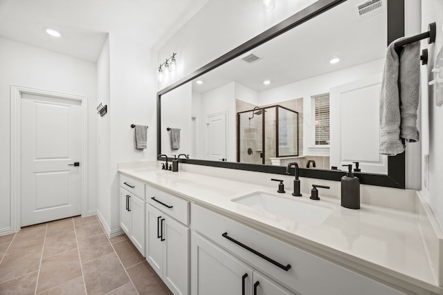 1224 Caprock Dr, Forney, TX 75126 - full bath featuring double vanity, a stall shower, recessed lighting, and tile patterned floors