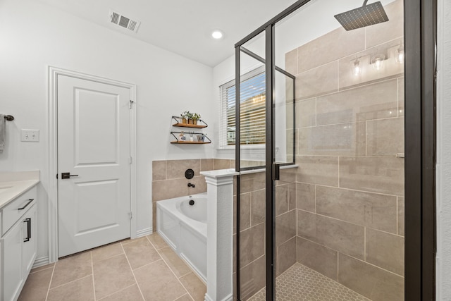 1224 Caprock Dr, Forney, TX 75126 - bathroom featuring a stall shower, a bath, vanity, and tile patterned floors