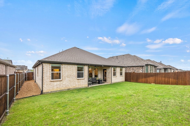 1224 Caprock Dr, Forney, TX 75126 - back of house featuring a fenced backyard, a patio, brick siding, and a shingled roof